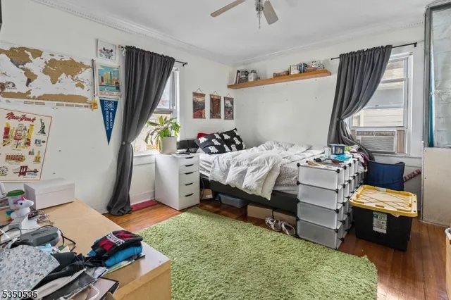 a bedroom with furniture and a window