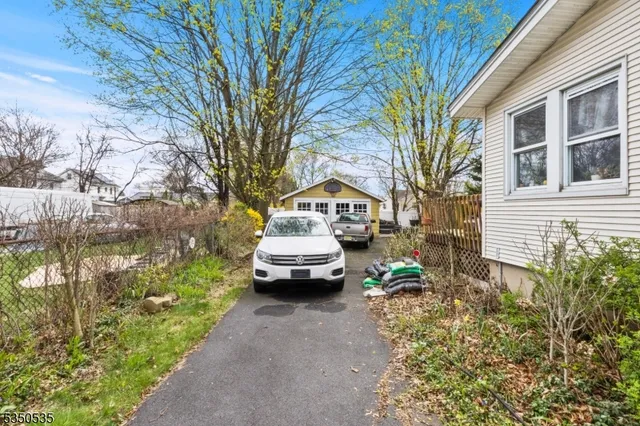 a view of a house with a backyard