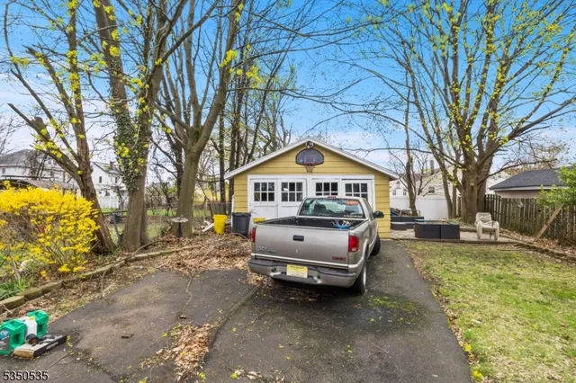 a view of a street with large trees