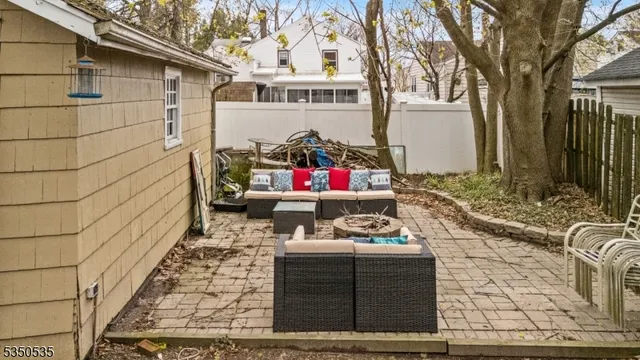 a front view of a house with outdoor seating