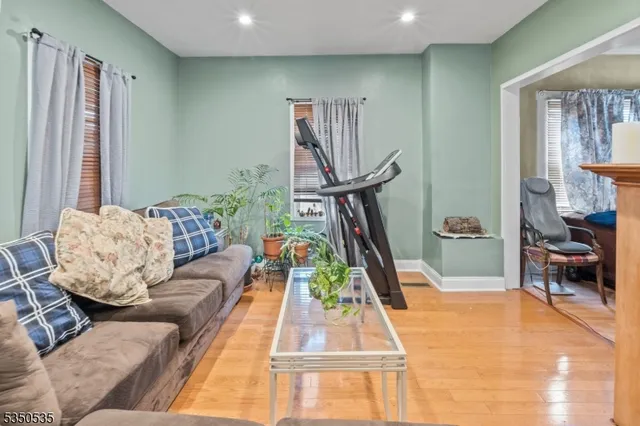 a living room with furniture and a rug