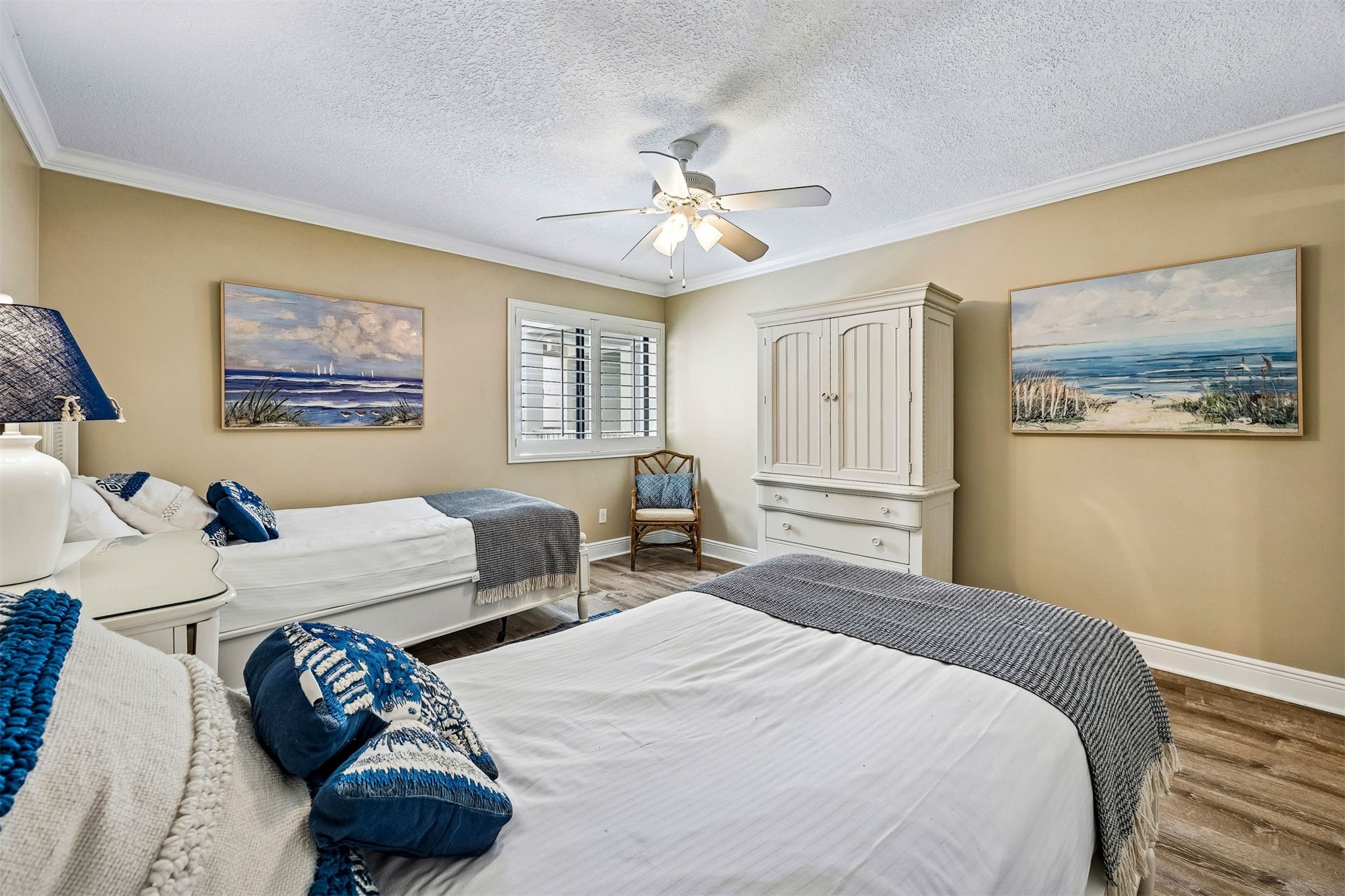 2117 Beachwood Road, Unit 2117 Fernandina Beach, FL 32034 - Photo 14 of 36 a bedroom with a bed and a chandelier