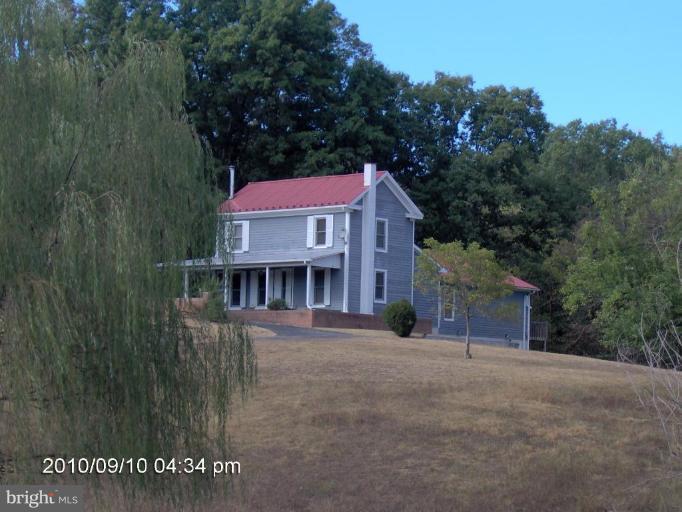 325 Silver Road Berkeley Springs, WV 25411 - Photo 1 of 21 a view of a house with a yard