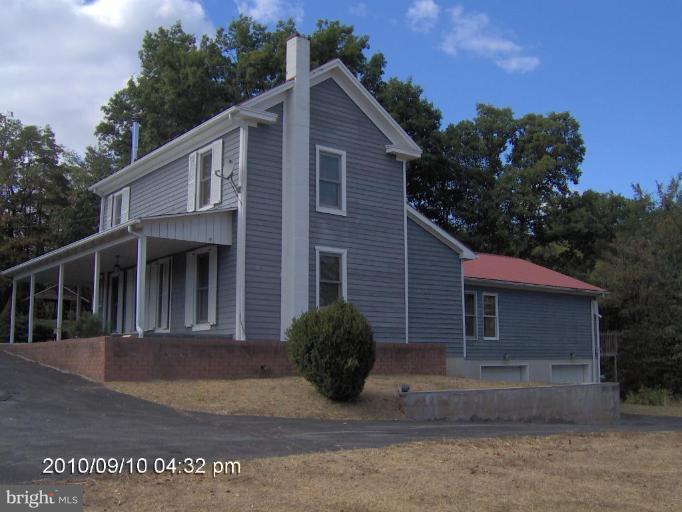 325 Silver Road Berkeley Springs, WV 25411 - Photo 2 of 21 a view of a house with a yard