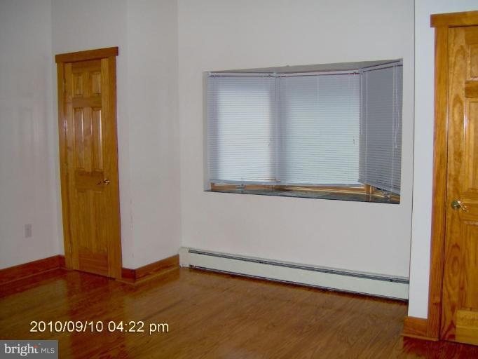 325 Silver Road Berkeley Springs, WV 25411 - Photo 16 of 21 a view of an empty room with window
