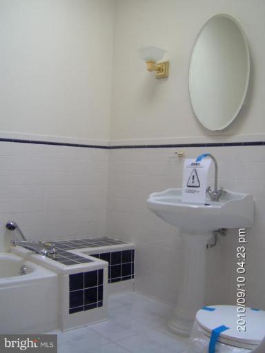 325 Silver Road Berkeley Springs, WV 25411 - Photo 21 of 21 a bathroom with a sink and a mirror