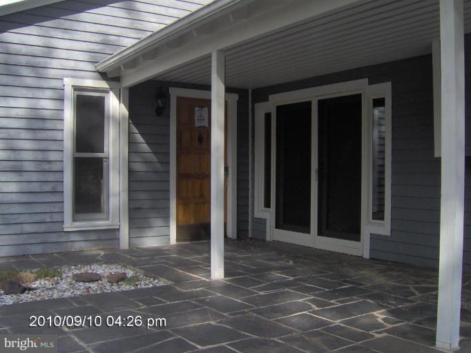 325 Silver Road Berkeley Springs, WV 25411 - Photo 5 of 21 a view of a house with a door