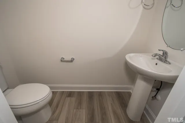 a bathroom with a sink a toilet and a bathtub