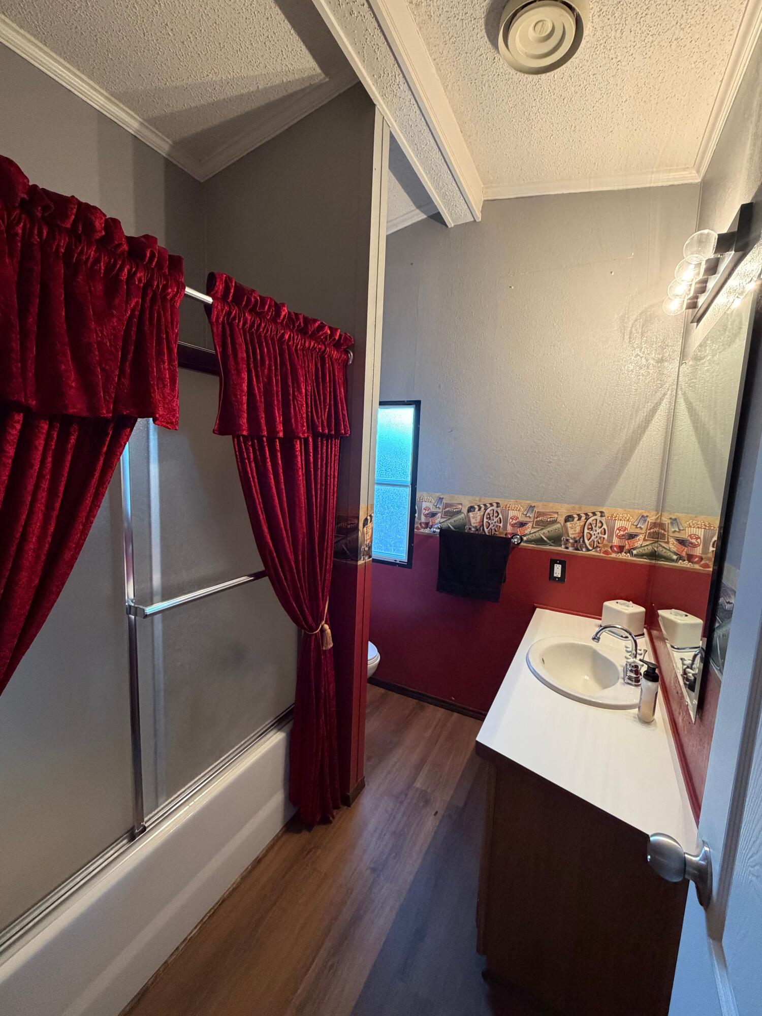 11120 Gentry Lane Slaton, TX 79364 - Photo 11 of 17 a view of a living room with furniture and a wooden floor