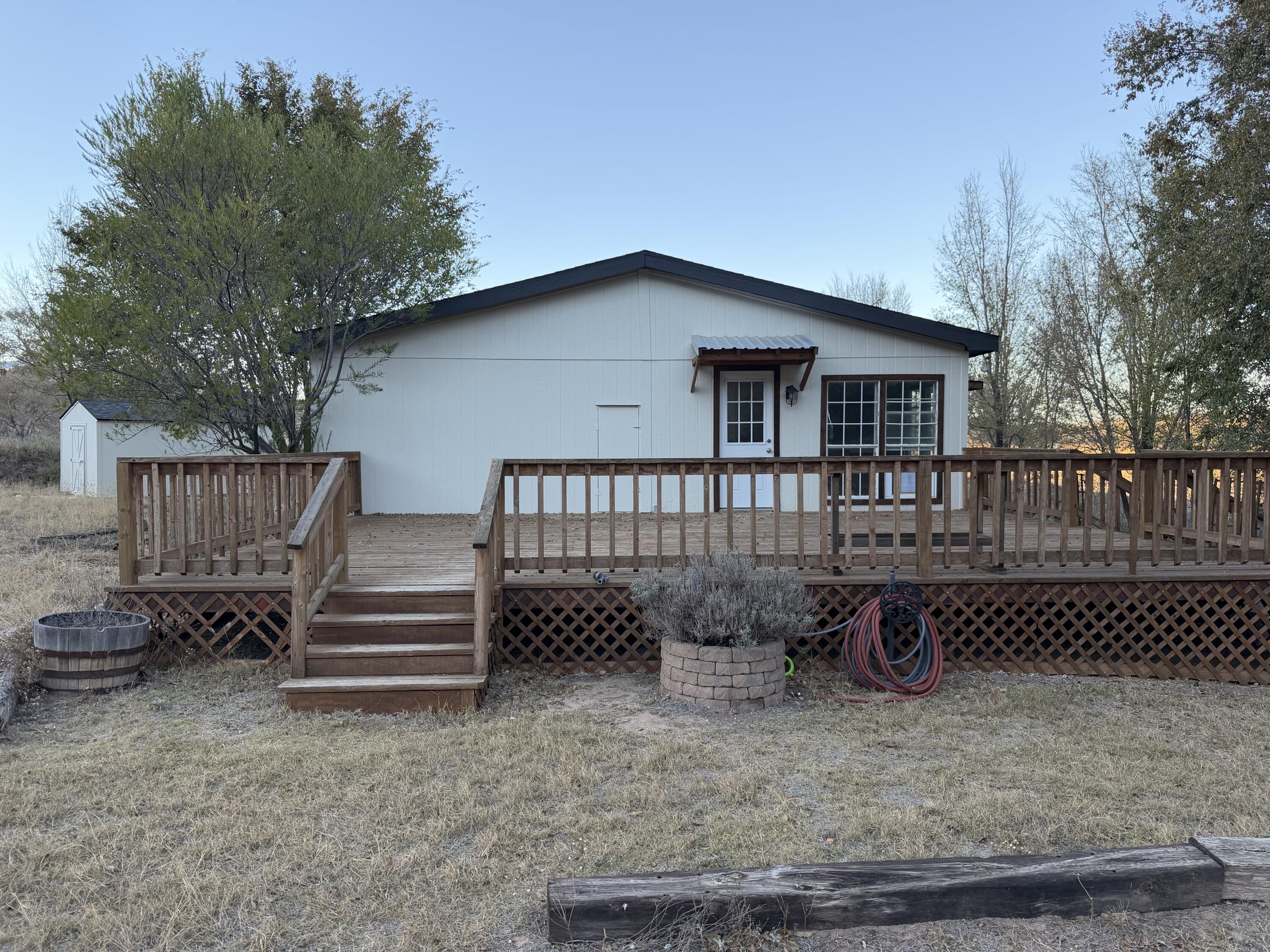 11120 Gentry Lane Slaton, TX 79364 - Photo 2 of 17 a view of a house with a yard and wooden fence