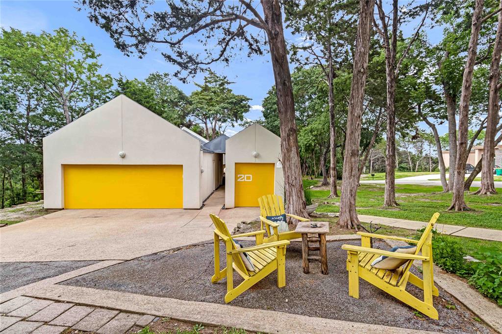 a view of a house with a swimming pool and a yard