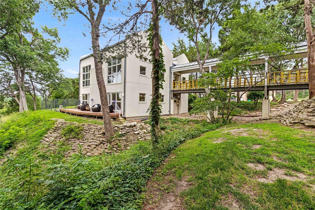 20 Summit Place Cedar Hill, TX 75104 - Photo 2 of 35 a view of a white house with a big yard and large tree