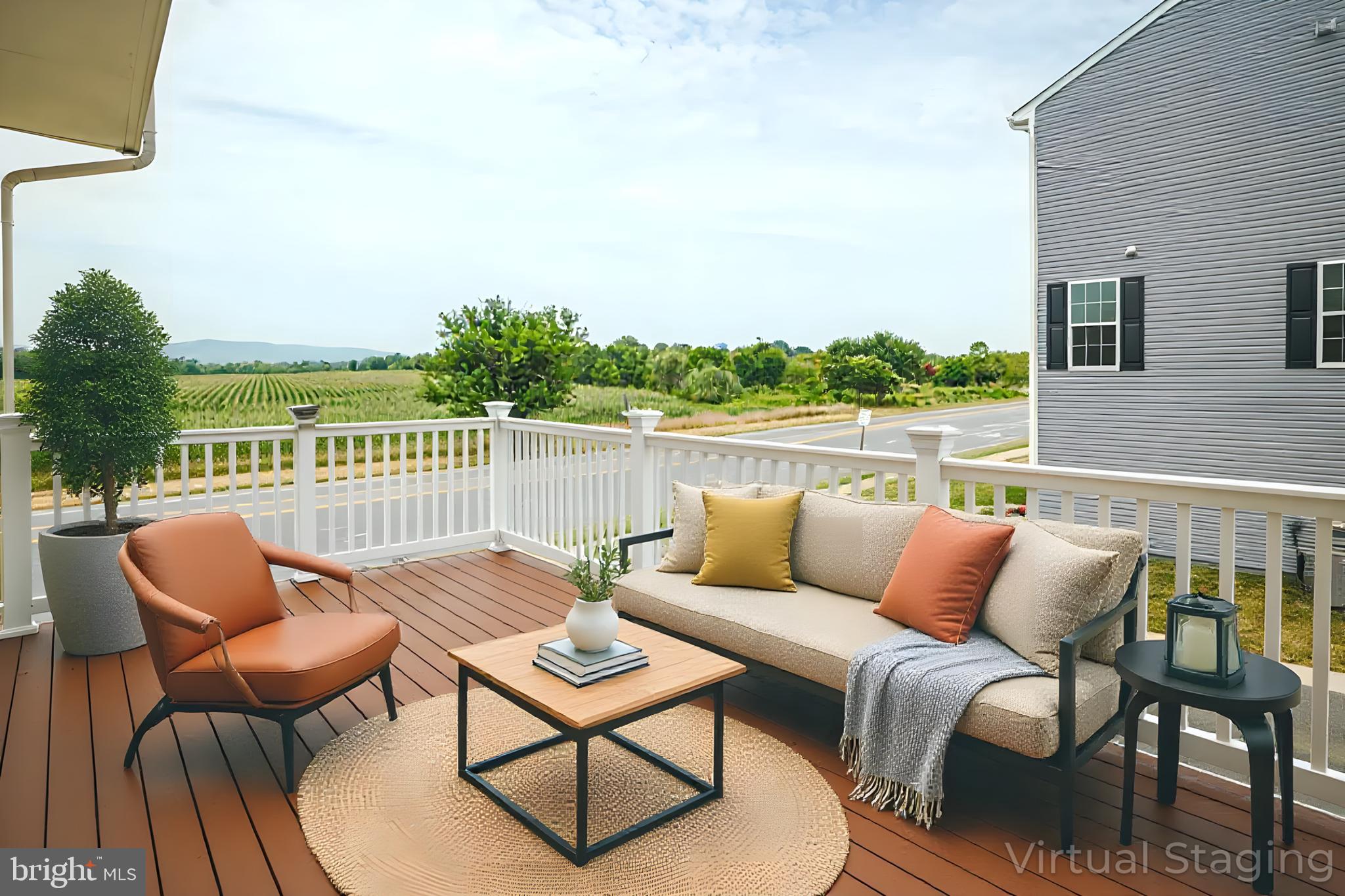 6150 Posey Street Frederick, MD 21703 - Photo 13 of 32 a roof deck with a couch and chairs