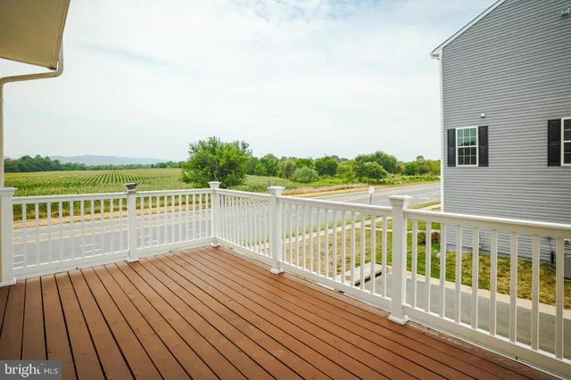 a view of balcony with wooden floor