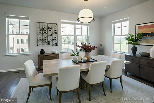 a dining room with furniture a chandelier and window
