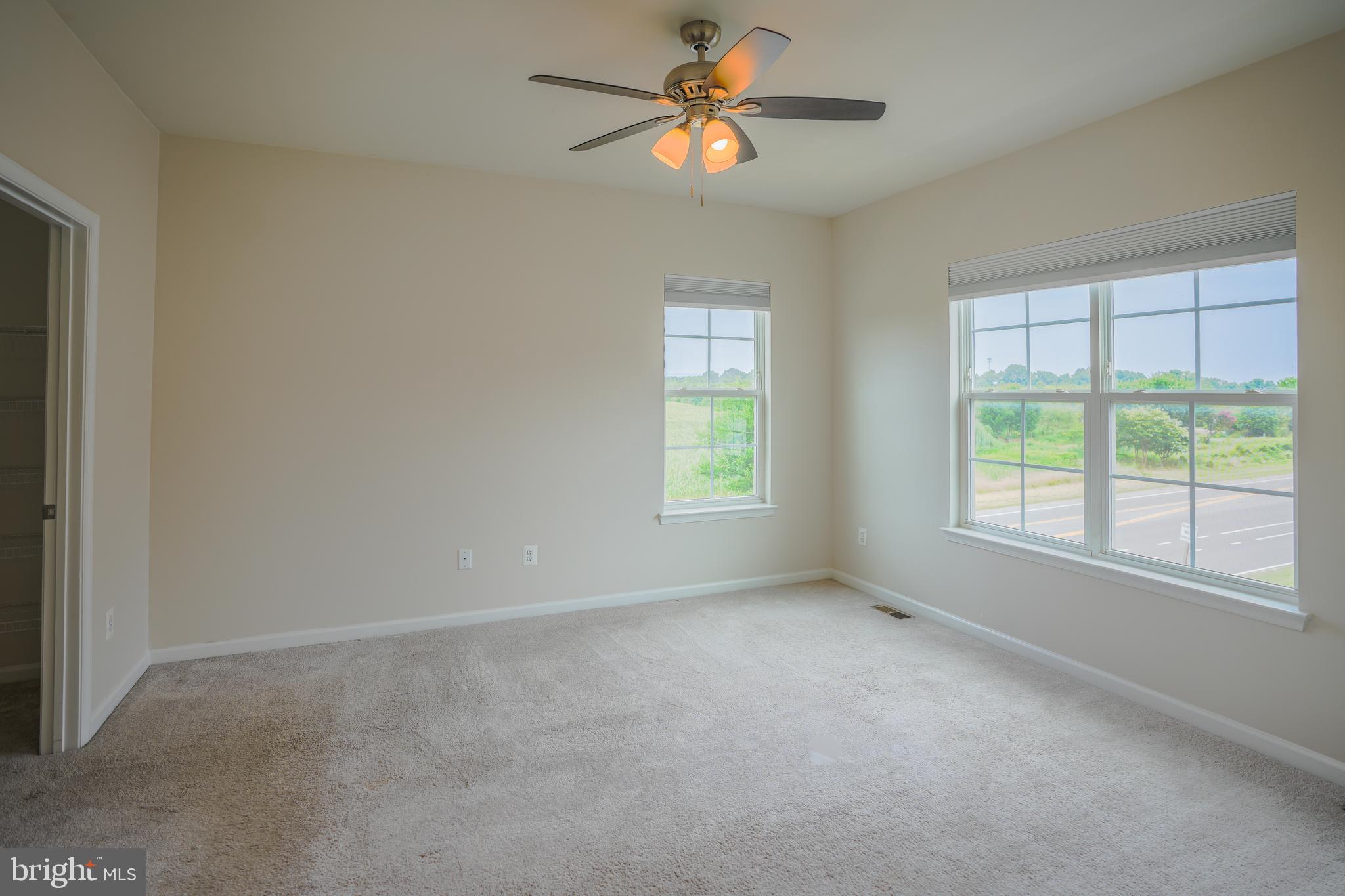 6150 Posey Street Frederick, MD 21703 - Photo 21 of 32 wooden floor in an empty room with a window