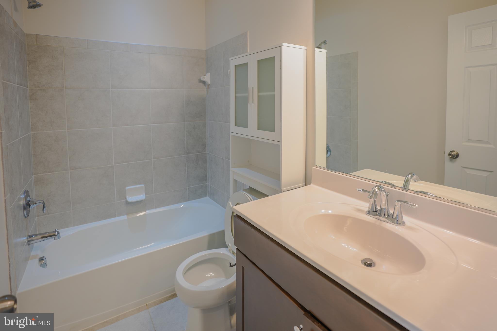 6150 Posey Street Frederick, MD 21703 - Photo 28 of 32 a bathroom with a sink a toilet and bathtub