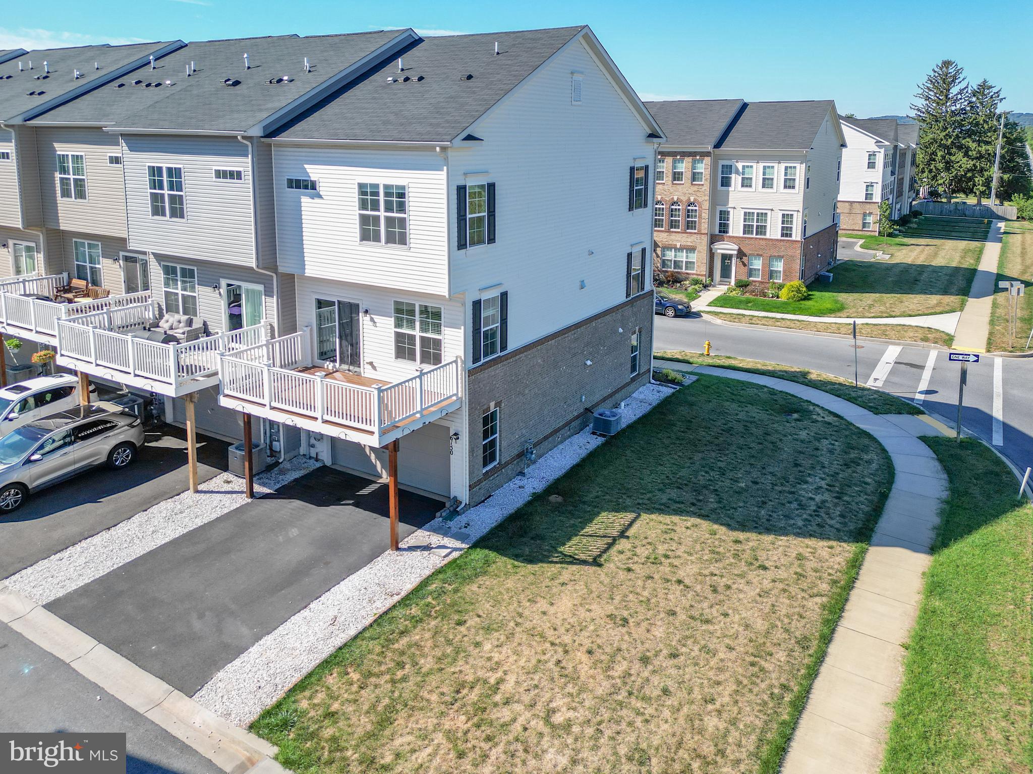 6150 Posey Street Frederick, MD 21703 - Photo 3 of 32 a view of a house with a yard and sitting area