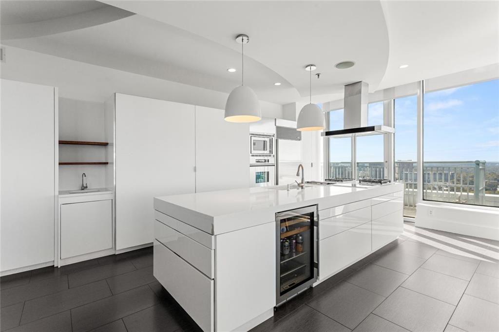 3338 Peachtree Road Northeast, Unit 3501 Atlanta, GA 30326 - Photo 15 of 46 a kitchen with a stove and a sink