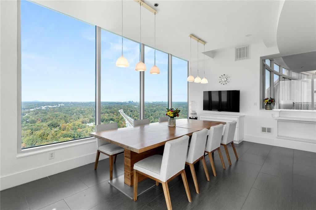 3338 Peachtree Road Northeast, Unit 3501 Atlanta, GA 30326 - Photo 18 of 46 a view of a dining room with furniture window and wooden floor