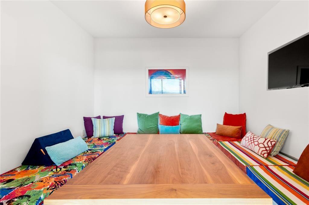 3338 Peachtree Road Northeast, Unit 3501 Atlanta, GA 30326 - Photo 23 of 46 a bedroom with a bed and a lamp on dresser