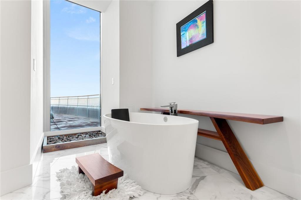 3338 Peachtree Road Northeast, Unit 3501 Atlanta, GA 30326 - Photo 30 of 46 a living room with couches and a rug