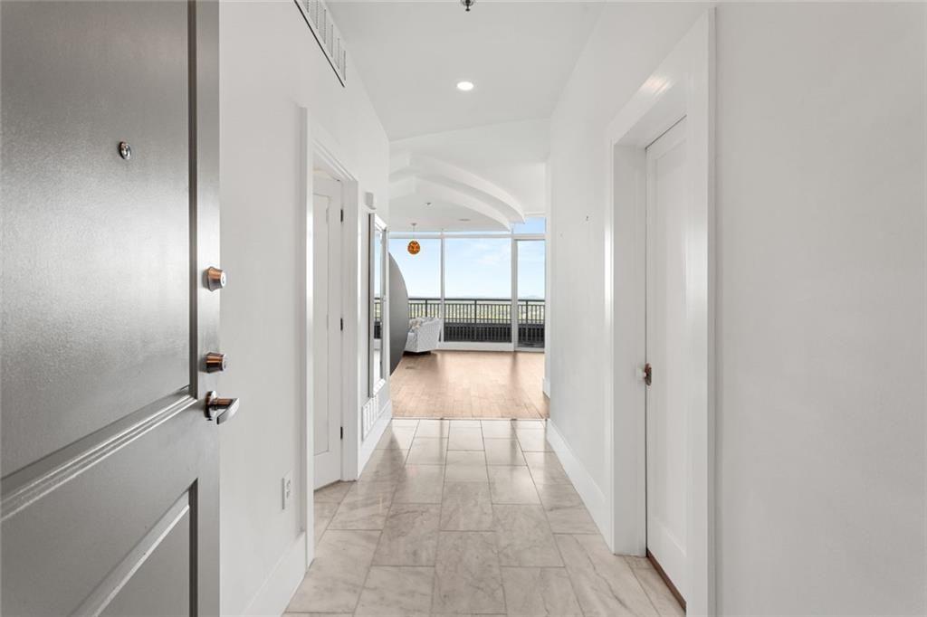 3338 Peachtree Road Northeast, Unit 3501 Atlanta, GA 30326 - Photo 3 of 46 a view of a hallway with a livingroom and a bathroom