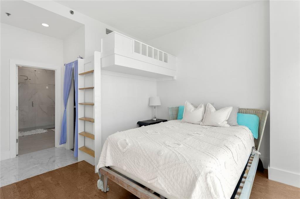 3338 Peachtree Road Northeast, Unit 3501 Atlanta, GA 30326 - Photo 34 of 46 a bedroom with a bed and a walk in closet