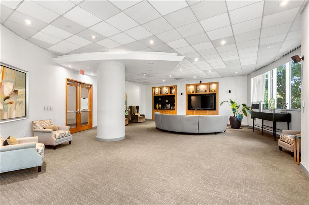3338 Peachtree Road Northeast, Unit 3501 Atlanta, GA 30326 - Photo 41 of 46 a living room with furniture and a table