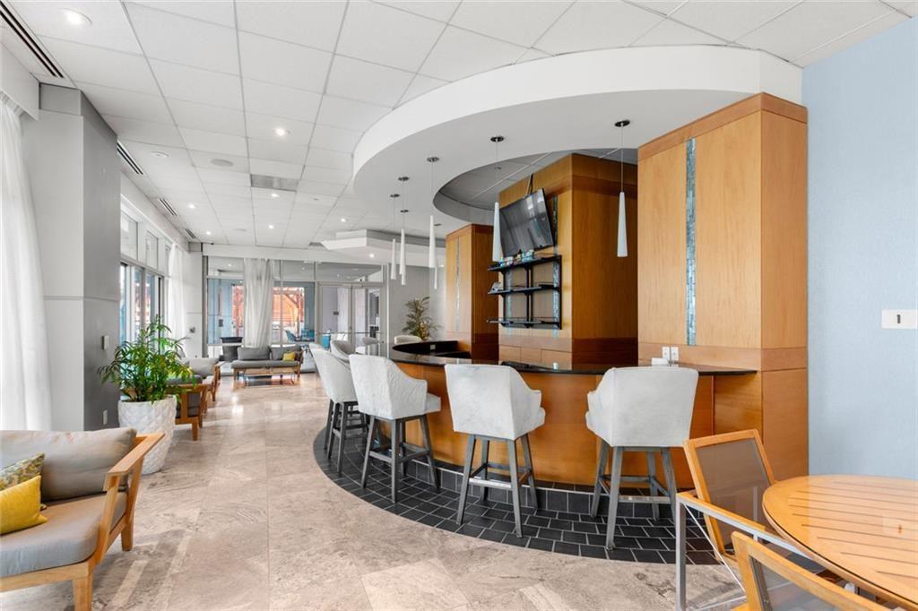 3338 Peachtree Road Northeast, Unit 3501 Atlanta, GA 30326 - Photo 42 of 46 a view of a dining room with furniture and a window