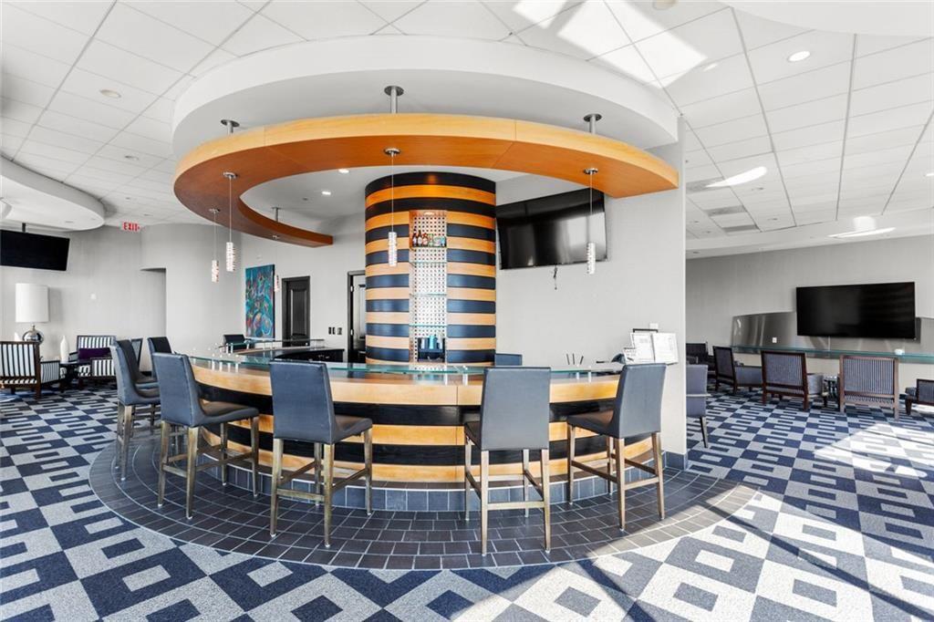 3338 Peachtree Road Northeast, Unit 3501 Atlanta, GA 30326 - Photo 43 of 46 a living room with furniture a rug and a table