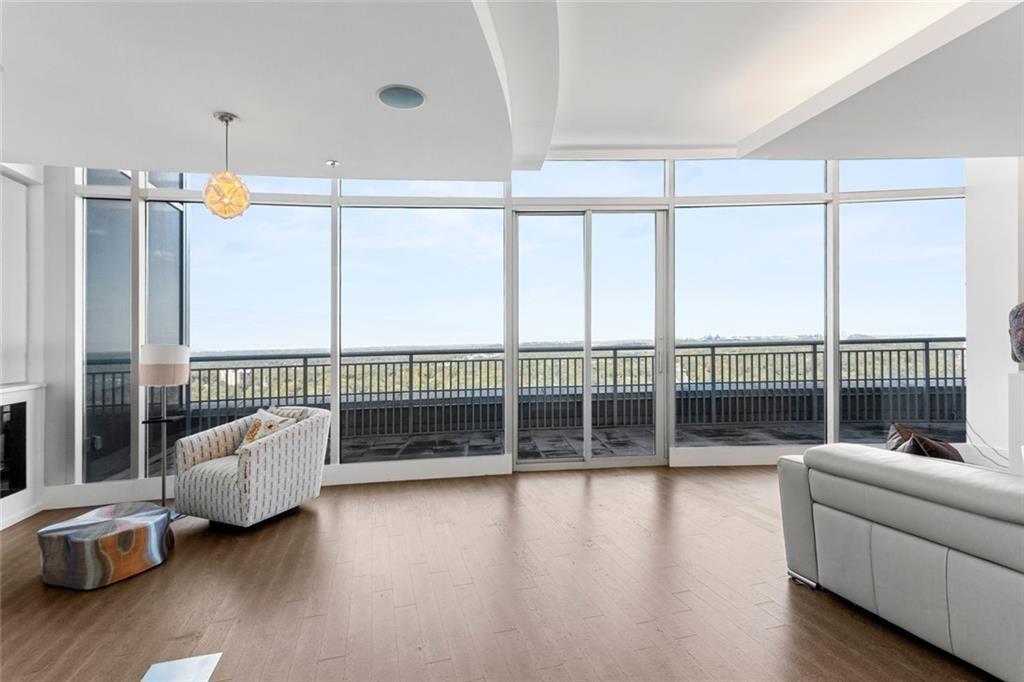 3338 Peachtree Road Northeast, Unit 3501 Atlanta, GA 30326 - Photo 5 of 46 a living room with furniture and a large window