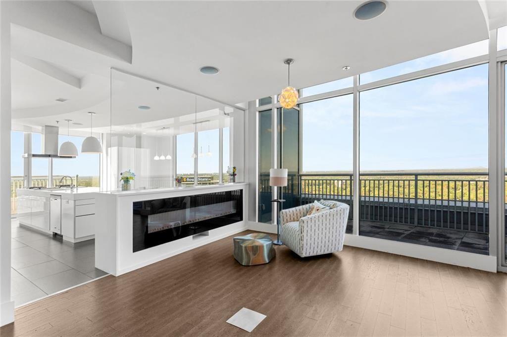 3338 Peachtree Road Northeast, Unit 3501 Atlanta, GA 30326 - Photo 6 of 46 a living room with furniture and a large window