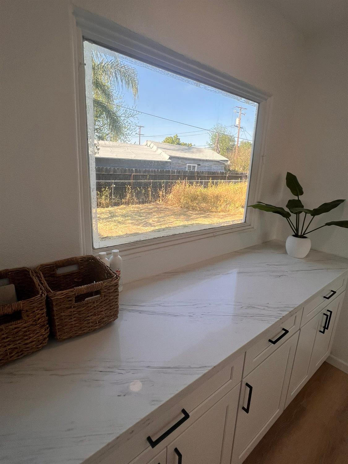 907 South 7th Street Fresno, CA 93702 - Photo 14 of 29 a living room with furniture and a large window