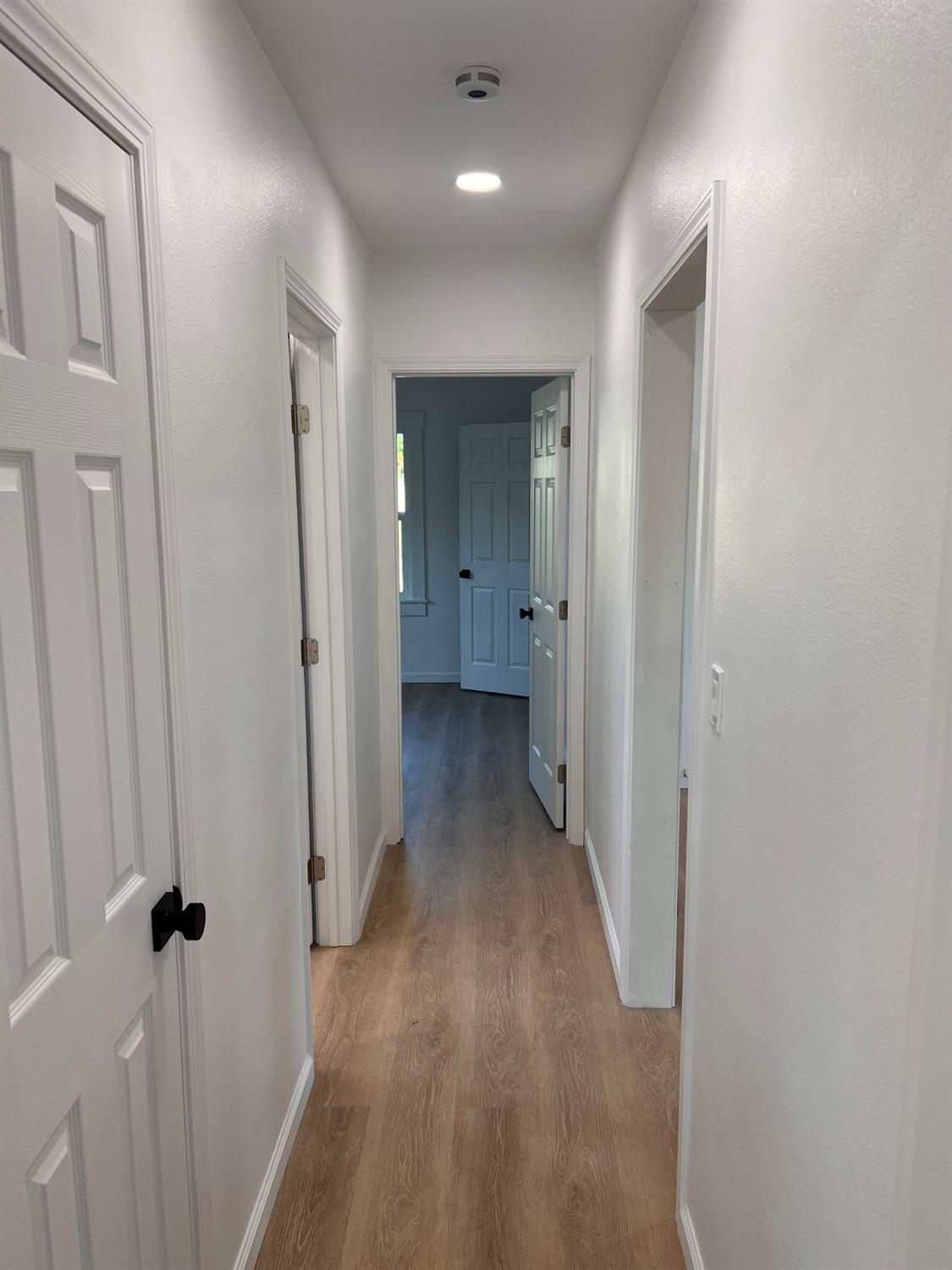 907 South 7th Street Fresno, CA 93702 - Photo 22 of 29 a view of a hallway with wooden floor
