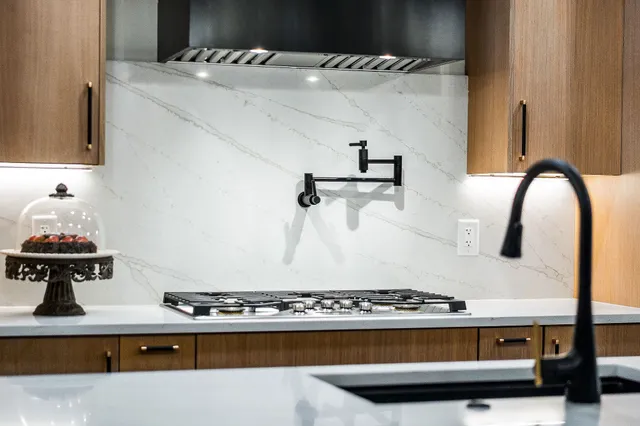 a kitchen with a stove and a sink