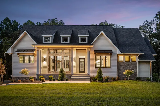 a front view of a house with a yard