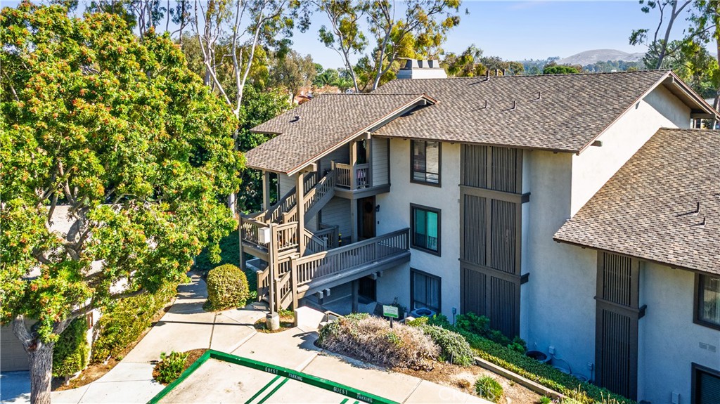 a aerial view of a house with a yard