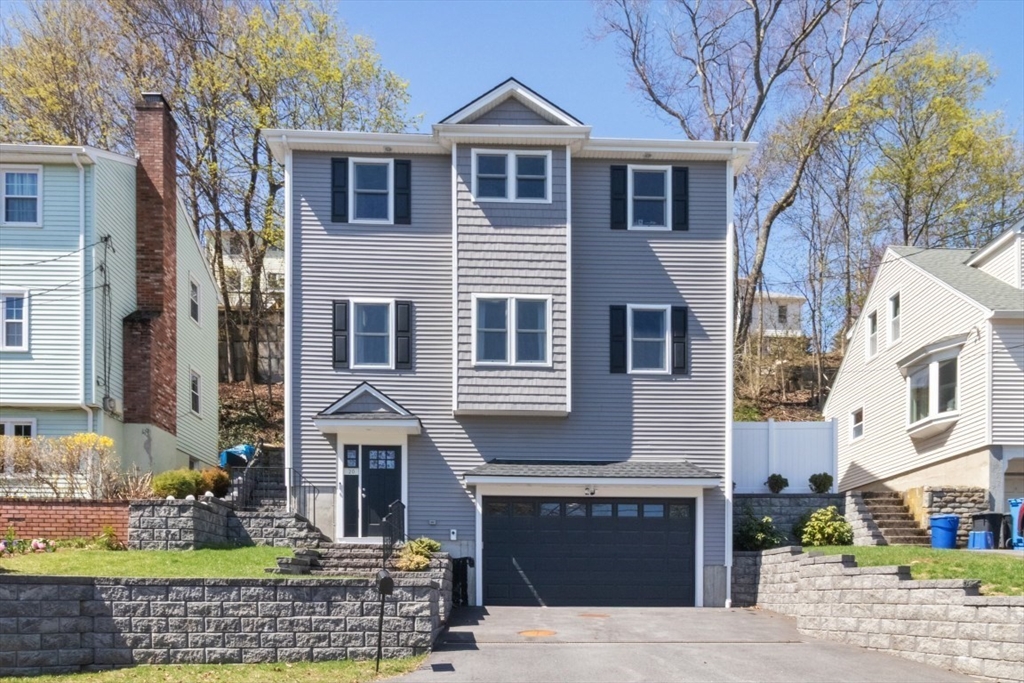 20 College Farm Road Waltham, MA 02451 - Photo 2 of 32 a front view of a house with garden