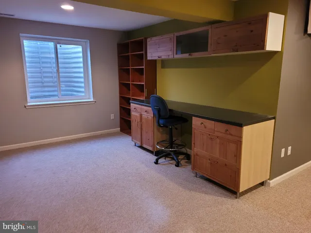 a view of an empty room with a fireplace