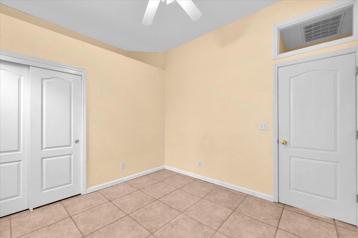 849 Megan Avenue Clovis, CA 93611 - Photo 13 of 53 an empty room with a ceiling fan