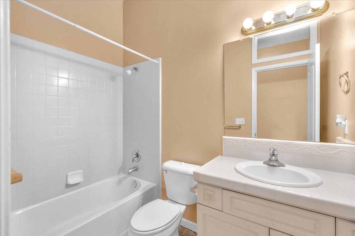 849 Megan Avenue Clovis, CA 93611 - Photo 19 of 53 a bathroom with a sink a toilet and shower