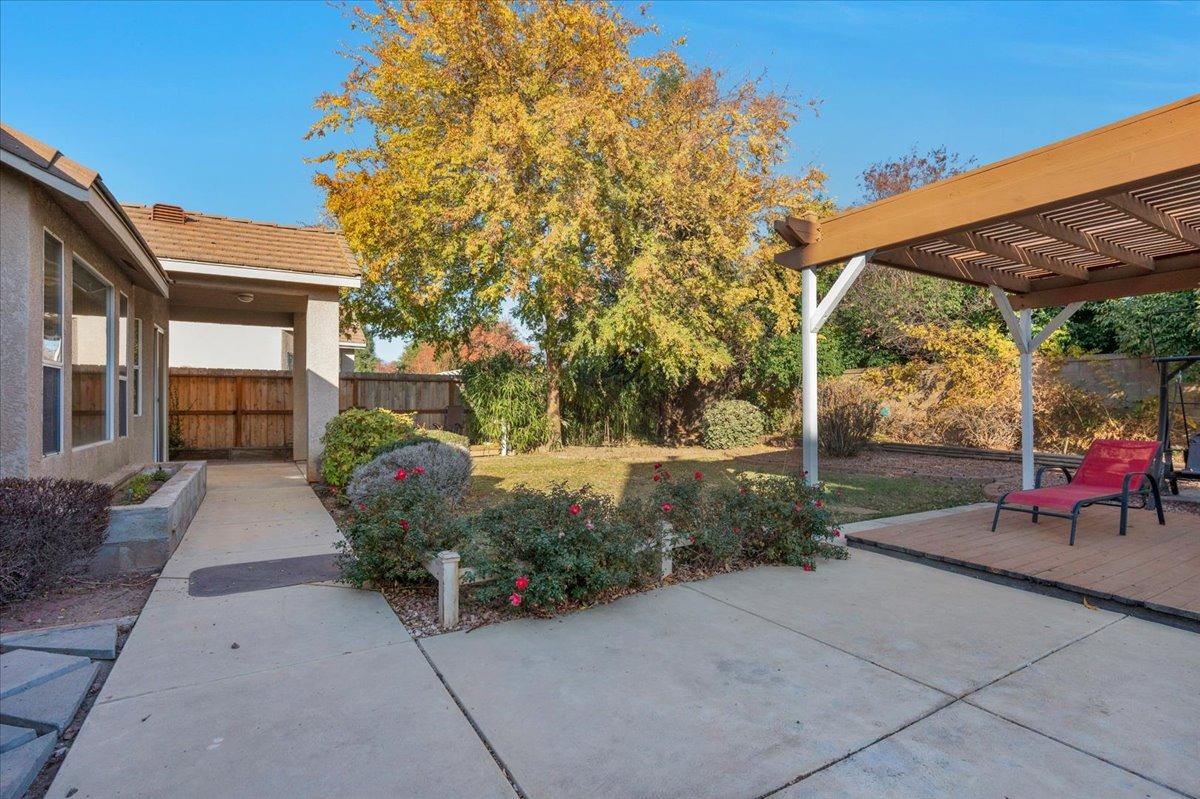 849 Megan Avenue Clovis, CA 93611 - Photo 29 of 53 a view of a patio with table and chairs and potted plants