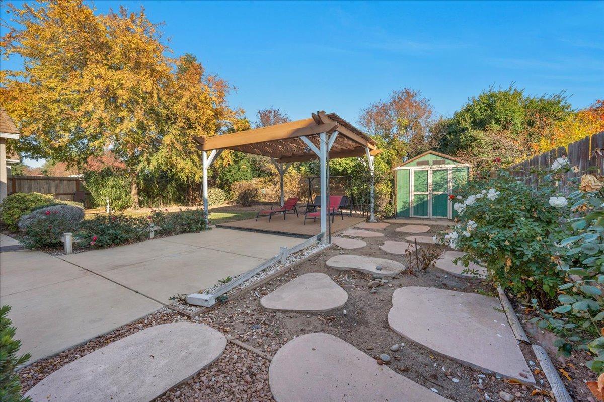 849 Megan Avenue Clovis, CA 93611 - Photo 31 of 53 a backyard of a house with table and chairs