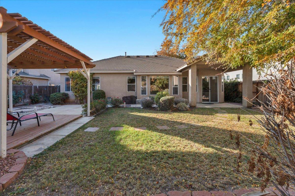 849 Megan Avenue Clovis, CA 93611 - Photo 34 of 53 a view of a house with backyard porch and sitting area