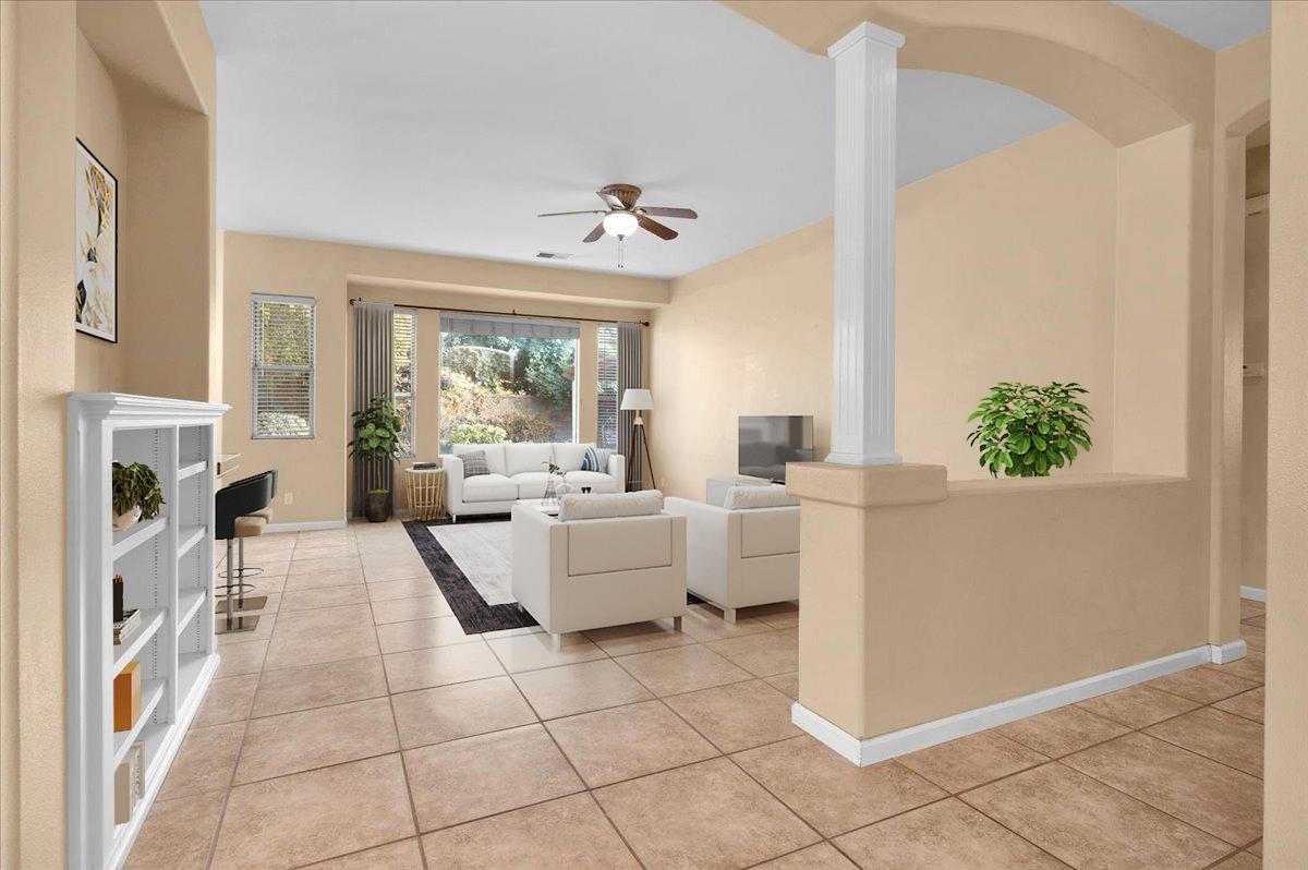 849 Megan Avenue Clovis, CA 93611 - Photo 51 of 53 a living room with fireplace furniture and a chandelier