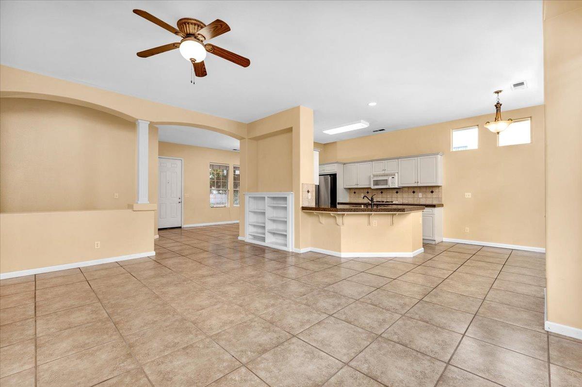 849 Megan Avenue Clovis, CA 93611 - Photo 7 of 53 a view of kitchen with refrigerator and window