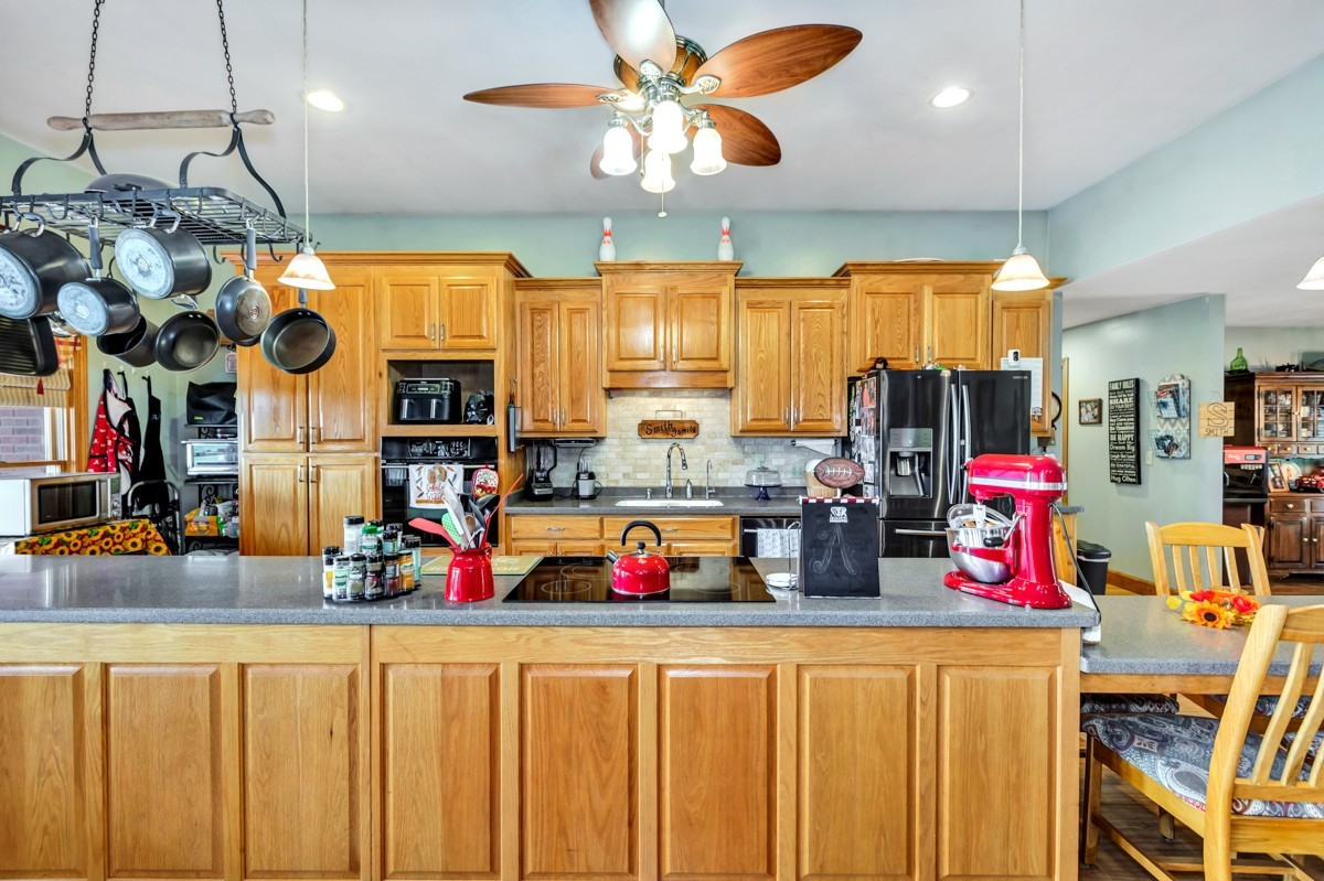 48 Old Baptist Road Ardmore, TN 38449 - Photo 12 of 41 a kitchen with lots of clutter and stainless steel appliances