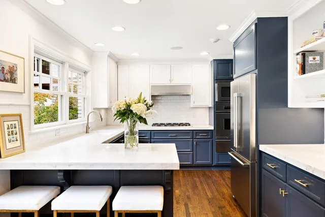 a kitchen with a sink and large window
