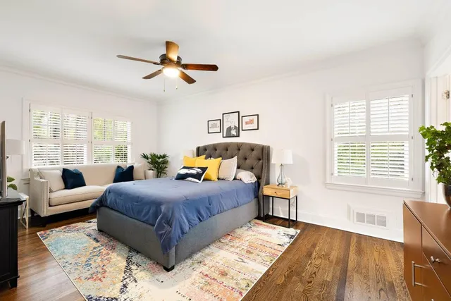 a view of a livingroom with furniture wooden floor and window
